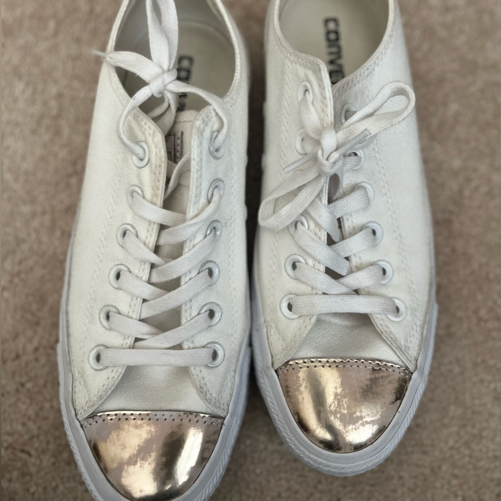 Off white and gold converse.